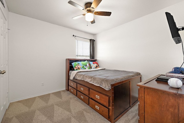 carpeted bedroom featuring visible vents and ceiling fan