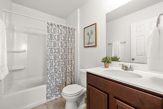 full bath featuring toilet, shower / tub combo, vanity, and tile patterned floors