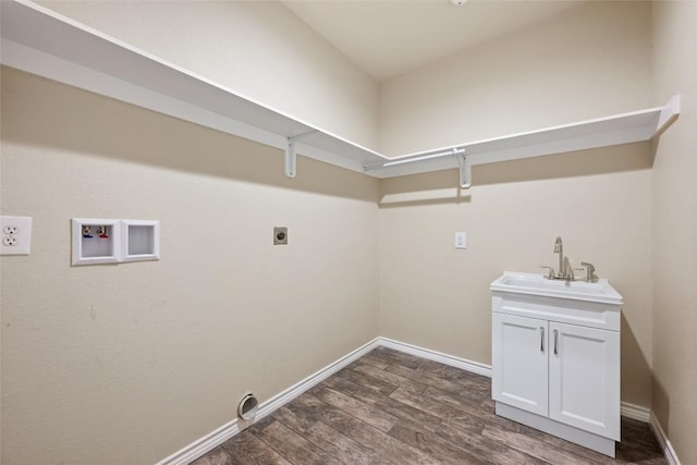 clothes washing area with cabinet space, dark wood-style flooring, hookup for an electric dryer, washer hookup, and a sink