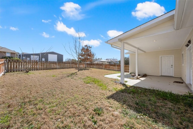 view of yard with a patio area and a fenced backyard