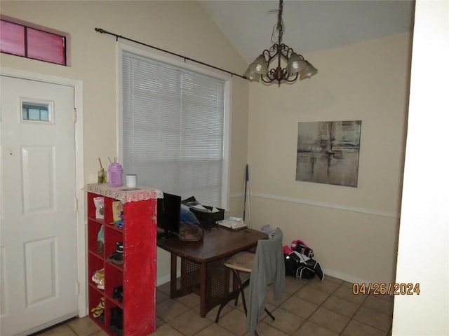 2300 Leon St Unit 202, Austin, TX 78705 - tiled dining room featuring a chandelier and vaulted ceiling