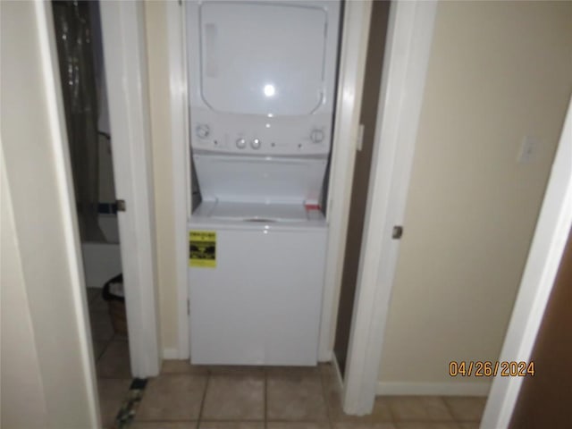 2300 Leon St Unit 202, Austin, TX 78705 - washroom featuring stacked washer / dryer and light tile patterned floors