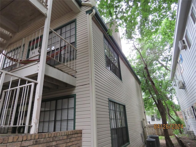 2300 Leon St Unit 202, Austin, TX 78705 - view of side of home with a balcony and a chimney