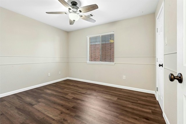 empty room with baseboards, visible vents, and wood finished floors