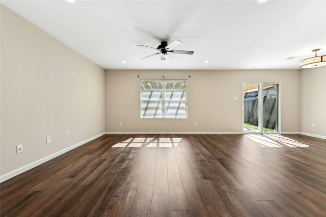 unfurnished room featuring dark wood-style floors, recessed lighting, a ceiling fan, and baseboards