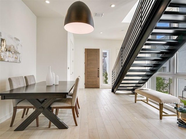 dining space featuring stairs, recessed lighting, visible vents, and light wood-style floors