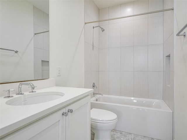 bathroom featuring vanity, shower / tub combination, and toilet