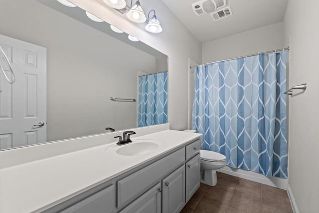 bathroom with visible vents, toilet, a shower with curtain, tile patterned flooring, and vanity