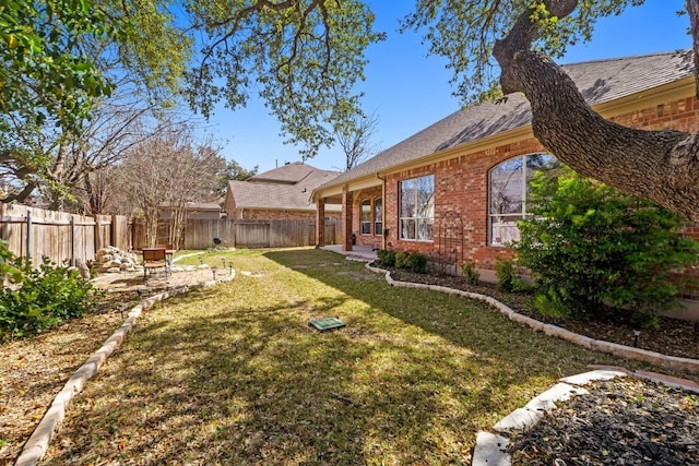 view of yard with a patio area and a fenced backyard