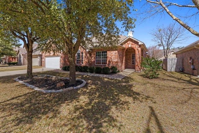 ranch-style house featuring a garage, brick siding, fence, driveway, and a chimney