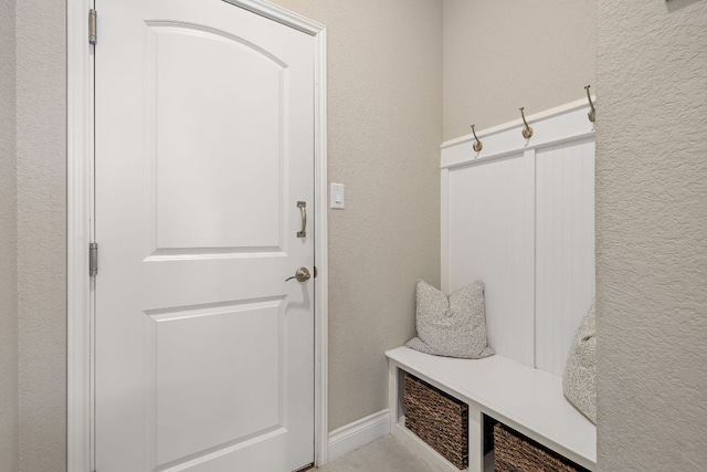 mudroom featuring a textured wall