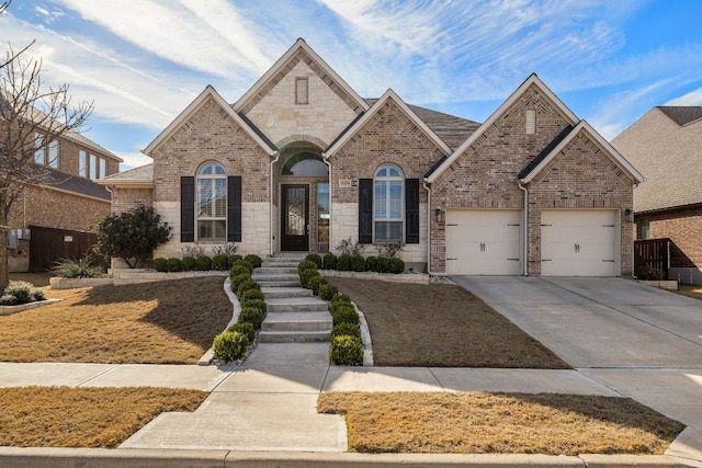 view of front of house with driveway, an attached garage, and brick siding