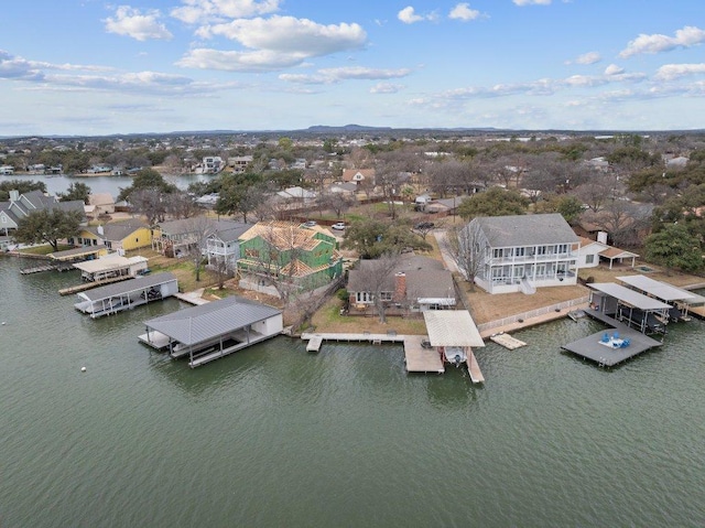 bird's eye view with a residential view and a water view