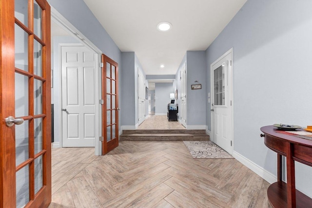 hall featuring recessed lighting, baseboards, and french doors