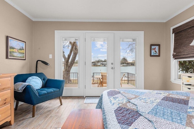 bedroom featuring access to exterior, light wood finished floors, and crown molding