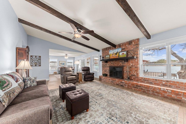 living room featuring vaulted ceiling with beams, a fireplace, ceiling fan, wood finished floors, and baseboards