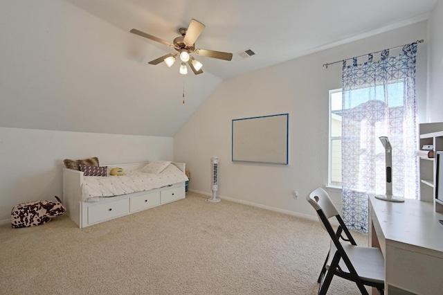 carpeted bedroom featuring a ceiling fan, lofted ceiling, visible vents, and baseboards