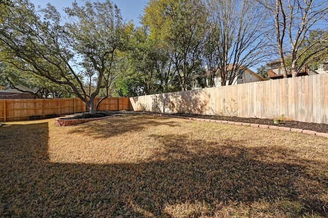 view of yard featuring a fenced backyard