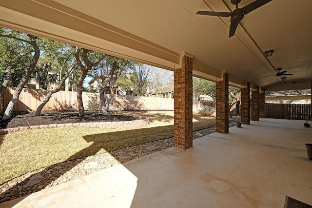 view of patio featuring a fenced backyard and ceiling fan