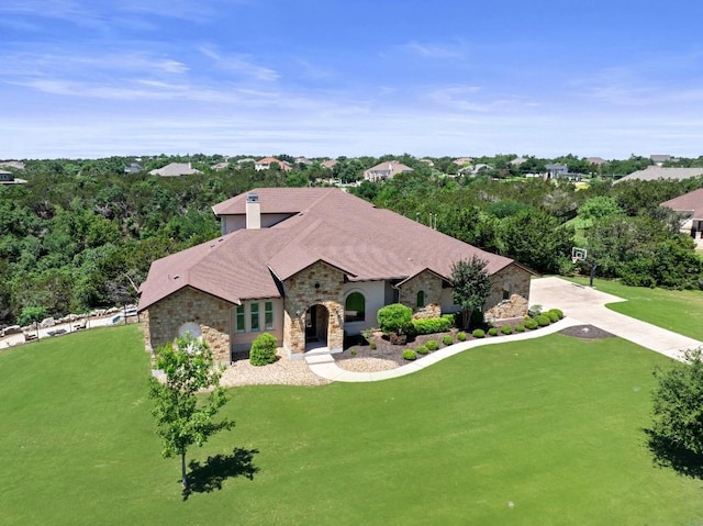 1104 Squaw Vly, Leander, TX 78641 - french country home featuring stone siding and a front lawn