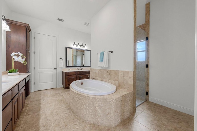 full bathroom featuring tile patterned flooring, a garden tub, two vanities, visible vents, and a stall shower