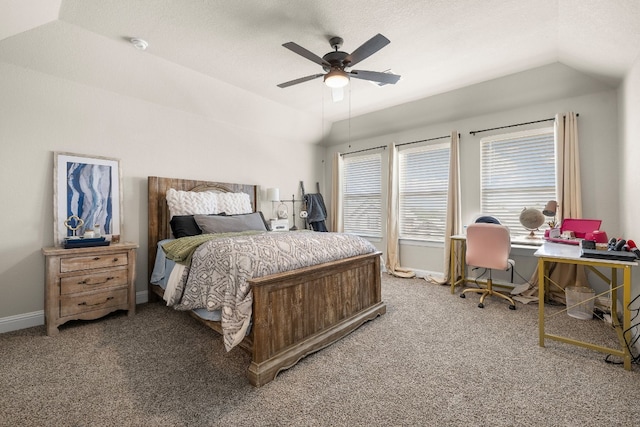 bedroom featuring carpet floors, baseboards, vaulted ceiling, and a ceiling fan