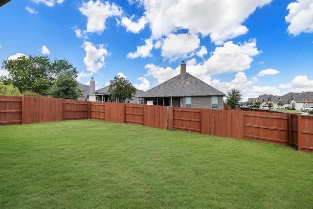 view of yard featuring a fenced backyard