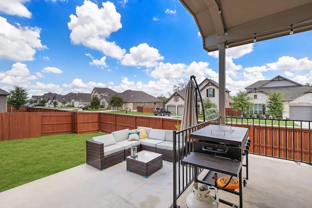 view of patio / terrace featuring a fenced backyard, a residential view, and an outdoor living space