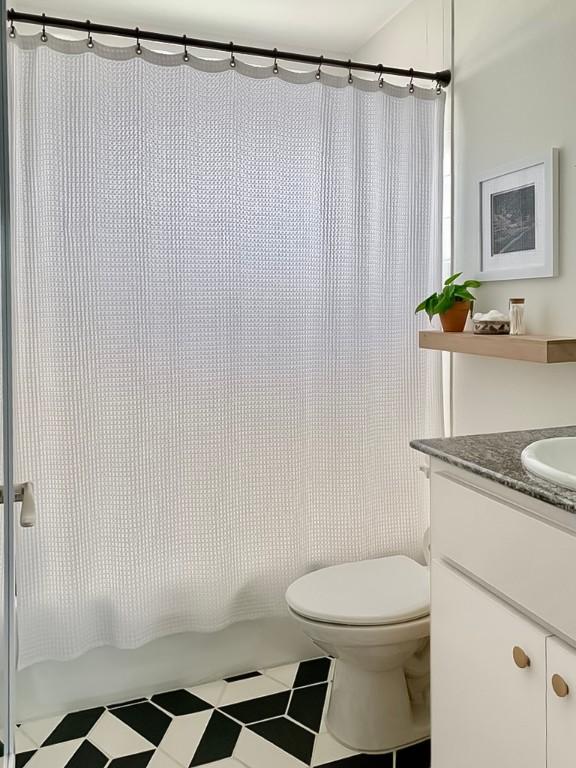 1422 Collier St Unit 102, Austin, TX 78704 - bathroom with vanity and shower / bath combo with shower curtain