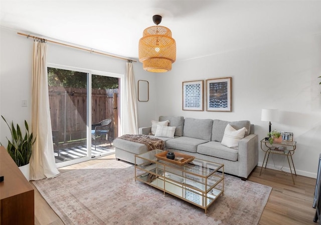 1422 Collier St Unit 102, Austin, TX 78704 - living room featuring wood finished floors and baseboards