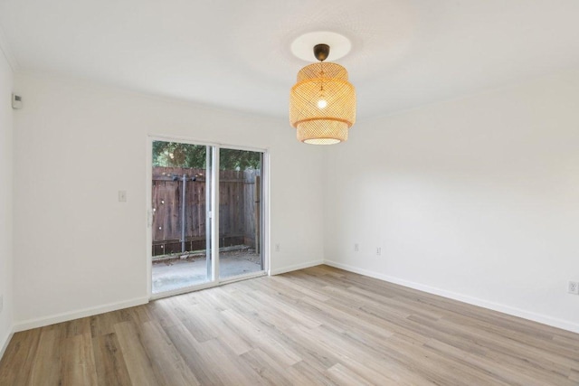 1422 Collier St Unit 102, Austin, TX 78704 - unfurnished room featuring wood finished floors and baseboards