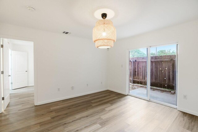 1422 Collier St Unit 102, Austin, TX 78704 - unfurnished room featuring wood finished floors and ornamental molding