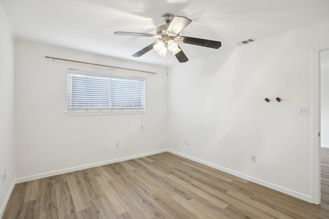 1422 Collier St Unit 102, Austin, TX 78704 - unfurnished room featuring light wood-style flooring, crown molding, baseboards, and a ceiling fan