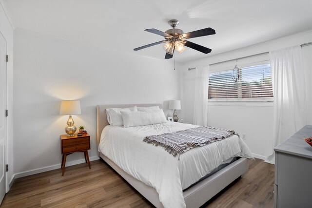 1422 Collier St Unit 102, Austin, TX 78704 - bedroom with light wood finished floors, a ceiling fan, and ornamental molding