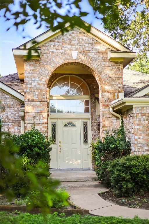 property entrance with brick siding