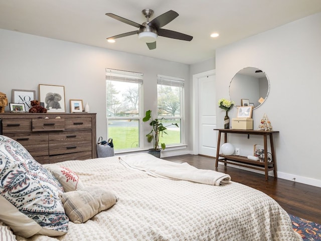 bedroom featuring ceiling fan, recessed lighting, wood finished floors, and baseboards