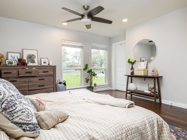 bedroom with baseboards, wood finished floors, recessed lighting, and ceiling fan