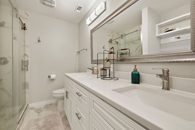 2101 Falcon Hill Dr, Austin, TX 78745 - full bathroom featuring marble finish floors, a marble finish shower, double vanity, toilet, and baseboards
