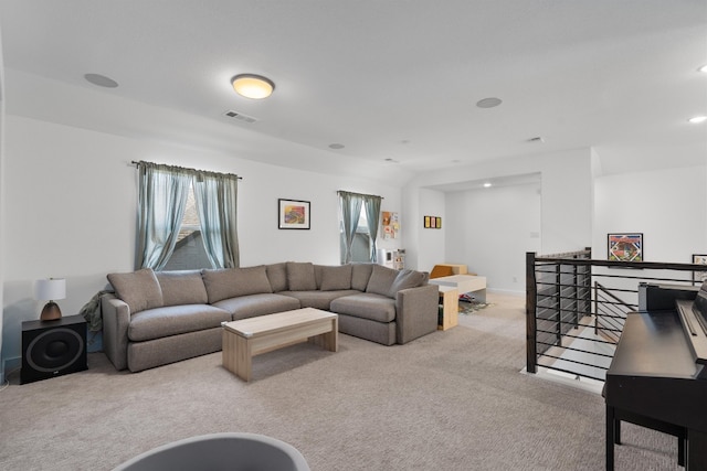 carpeted living area with baseboards, visible vents, and recessed lighting