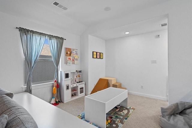 interior space with carpet, visible vents, and baseboards