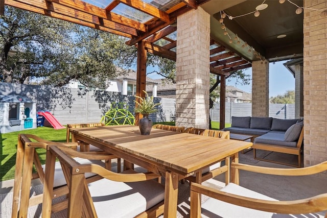 view of patio / terrace featuring outdoor dining area, a fenced backyard, and an outdoor living space