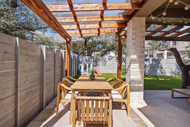 view of patio / terrace featuring outdoor dining space, a fenced backyard, and a pergola