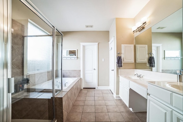 bathroom with a garden tub, tile patterned flooring, visible vents, and a stall shower