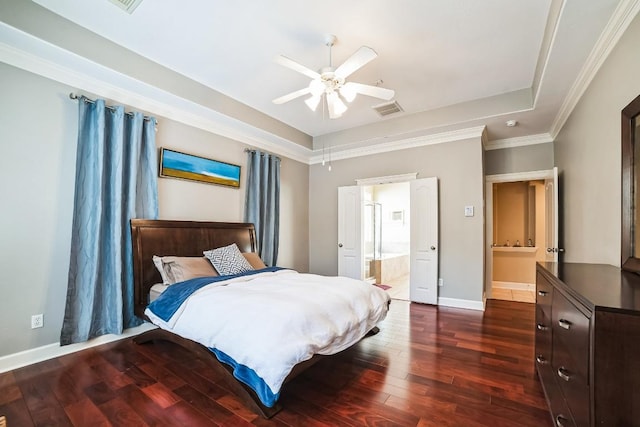 bedroom with dark wood-style floors, a raised ceiling, visible vents, and baseboards