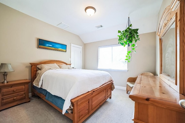 bedroom with light colored carpet, visible vents, lofted ceiling, and baseboards