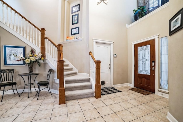 foyer entrance with a healthy amount of sunlight and tile patterned flooring