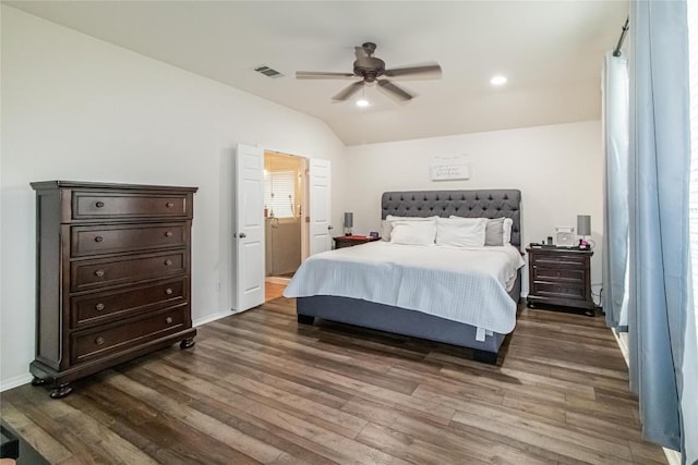 bedroom featuring lofted ceiling, visible vents, recessed lighting, and wood finished floors