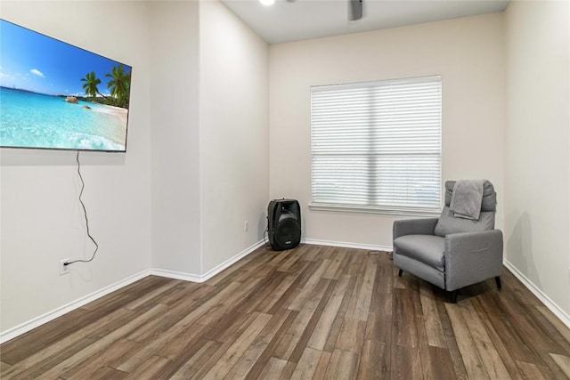 unfurnished room featuring ceiling fan, baseboards, and wood finished floors