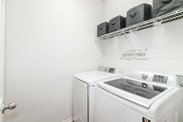 laundry area featuring washing machine and dryer and laundry area