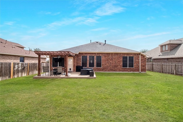 rear view of house with brick siding, a patio, a fenced backyard, and a pergola